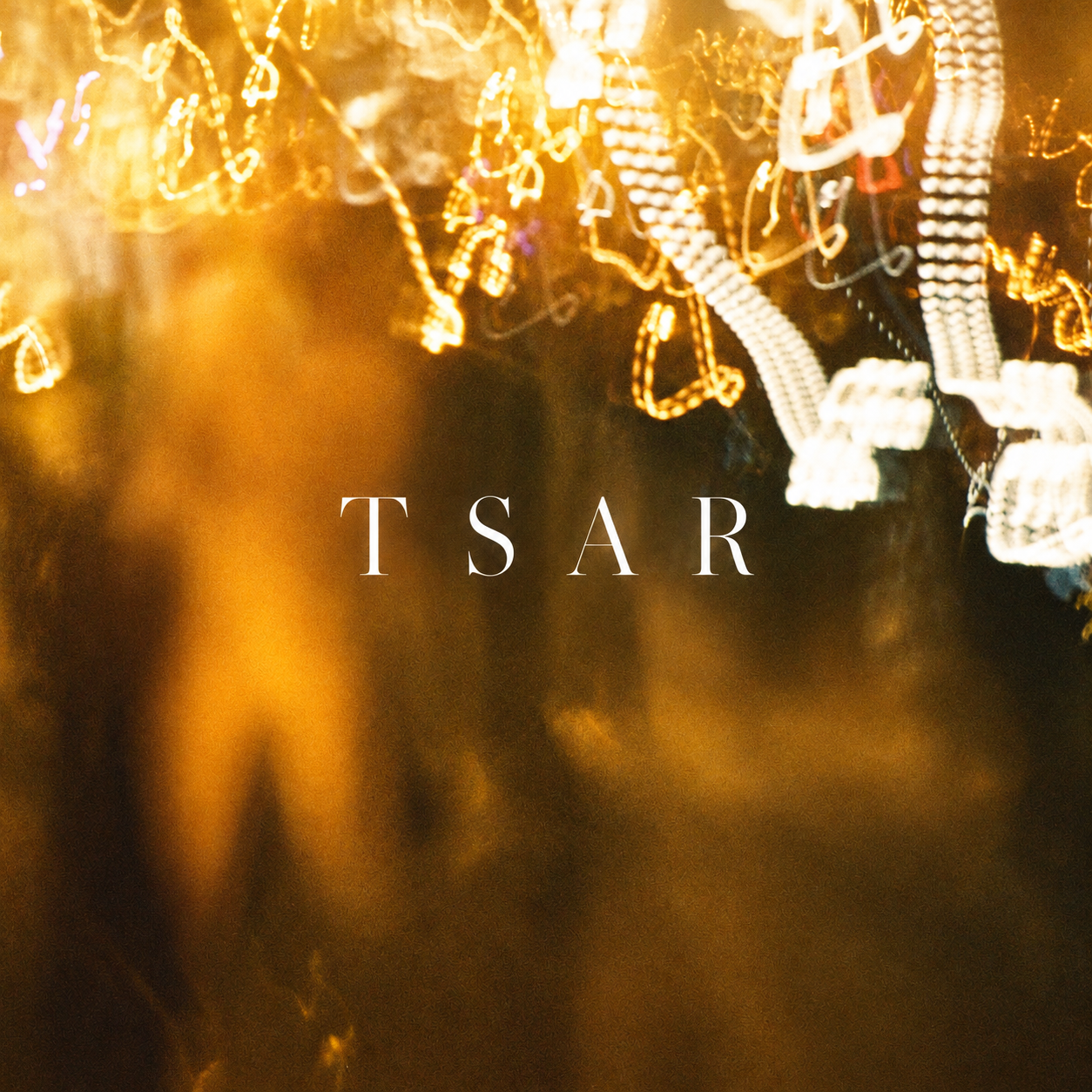TSAR SET cover artwork, glowing gold jewelry over a dark figure